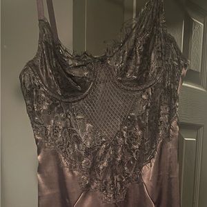A size S, lace, black mini dress, tried on but never worn anywhere